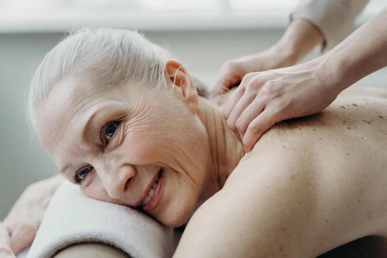 Senior client receiving a relaxing massage
